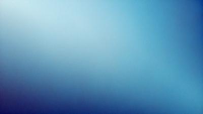 The primary subject of the image is a blue sky with no clouds. The setting is a vast, open space with no visible landmarks or objects. The visual style is a simple, clean, and minimalistic representation of the sky. The colors and mood convey a sense of tranquility and calmness.