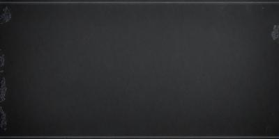 The primary subject of the image is a black background. The setting is a dark room, and the visual style is a black and white photo. The colors and mood of the image are dark and moody, creating a sense of mystery or drama.