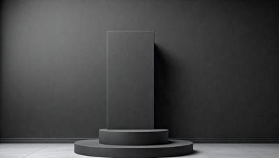 The primary subject of the image is a large, gray, square-shaped object, which appears to be a sculpture or a piece of art. The setting is a black wall, which serves as the background for the artwork. The visual style of the image is a black and white photo, giving it a classic and timeless appearance. The colors and mood of the image are predominantly dark, with the gray sculpture standing out against the black wall.