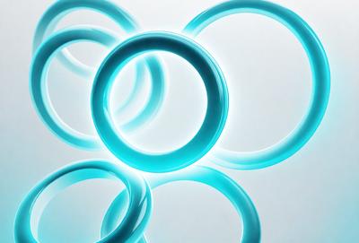 The primary subject of the image is a collection of blue rings or circles, which are arranged in a visually appealing manner. The setting is a white background, which provides a clean and minimalist look to the scene. The visual style of the image is a combination of photo and digital art, as the rings appear to be digitally manipulated or edited. The dominant colors in the image are blue, which creates a calm and soothing atmosphere.