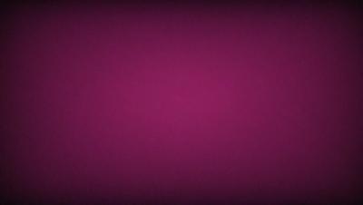 The primary subject of the image is a purple background. The setting is a dark, purple room. The visual style is a close-up of the purple wall. The colors and mood are predominantly purple, creating a calm and serene atmosphere.