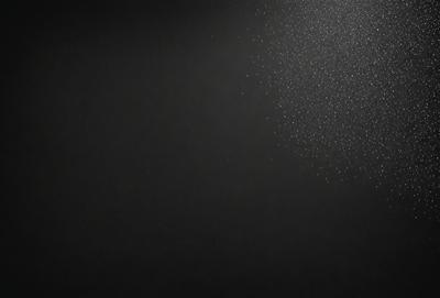 The primary subject of the image is a black background with a white light source. The setting is a dark room, and the visual style is a black and white photo. The dominant colors are black and white, creating a moody atmosphere.