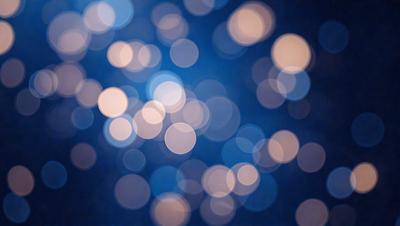 The primary subject of the image is a blue background with a pattern of white lights or stars. The setting appears to be a nighttime sky, creating a serene and peaceful atmosphere. The visual style of the image is a combination of a photo and digital art, as it captures the beauty of the night sky with the white stars. The colors and mood of the image are predominantly blue and white, giving it a calming and tranquil feel.