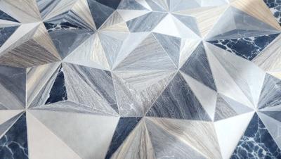 The primary subject of the image is a patterned marble tile. The setting is a white surface, possibly a table or a wall, with the marble tile as the main focus. The visual style appears to be a combination of a photo and digital art, as the marble tile has a unique and intricate design. The colors and mood of the image are predominantly neutral, with the marble tile providing a sense of sophistication and elegance.