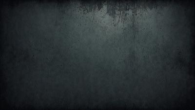 The primary subject of the image is a large, dark blue wall with a rough texture. The setting is a room with a blue-gray color scheme. The visual style is a close-up of the wall, showcasing its unique texture. The colors and mood of the image are dark and moody, creating a sense of depth and intrigue.