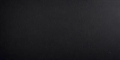 The image is a black and white photo of a black background.