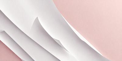 The primary subject of the image is a stack of white paper. The setting is a pink background, which adds a contrasting color to the scene. The visual style is a close-up of the paper, showcasing its texture and details. The colors and mood of the image are predominantly white and pink, creating a clean and elegant atmosphere.