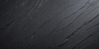 The primary subject of the image is a black and white photo of a wall with a textured surface. The setting is a dark room, and the visual style is a close-up of the wall. The colors and mood of the image are predominantly dark and moody, with the black and white color scheme adding to the atmosphere.