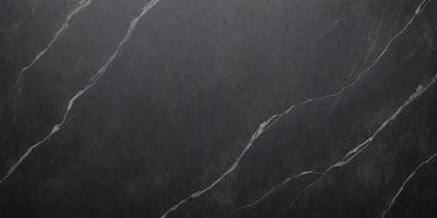 The primary subject of the image is a marble-like surface, which appears to be a black marble countertop. The setting is a room with a gray background, which adds to the overall atmosphere. The visual style of the image is a close-up of the marble countertop, showcasing its texture and details. The colors and mood of the image are dark and moody, with the black marble and gray background creating a dramatic and sophisticated ambiance.