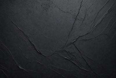 The primary subject of the image is a black background with a pattern of white lines. The setting is a dark room, and the visual style is a close-up of the black background. The colors and mood of the image are predominantly dark and moody, with the white lines adding a touch of contrast.