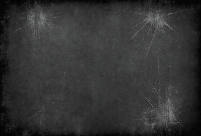 The primary subject of the image is a black and white photo of a gray background. The setting is a dark room, and the visual style is a black and white photo. The colors and mood of the image are dark and moody.