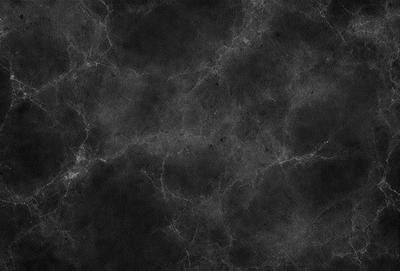 The primary subject of the image is a black and white photo of a wall with a pattern of black and white dots. The setting is a black background, and the visual style is a close-up of the wall. The colors and mood of the image are predominantly black and white, creating a stark and minimalist atmosphere.