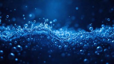 The primary subject of the image is a blue ocean with a wave. The setting is a dark blue sky, and the visual style is a photo. The colors and mood of the image are predominantly dark and moody, with the blue ocean and sky creating a serene atmosphere.