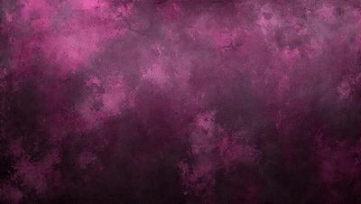 The primary subject of the image is a purple wall with a pinkish hue. The setting is a room with a purple background. The visual style is a close-up of the wall, showcasing the colorful texture. The dominant colors are purple and pink, creating a warm and inviting atmosphere.
