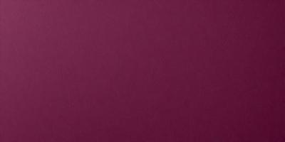 The primary subject of the image is a large, purple wall. The setting is a room with a red background, which creates a striking contrast with the purple wall. The visual style is a close-up of the wall, showcasing its color and texture. The dominant colors are purple and red, creating a bold and vibrant atmosphere.