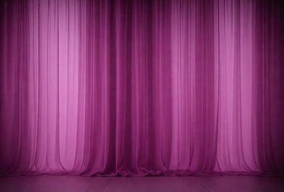 The primary subject of the image is a purple curtain, which is the main object and scene of the image. The setting is a stage or a theater, with the curtain as the backdrop. The visual style is a photo, capturing the purple curtain in its natural environment. The colors and mood of the image are predominantly purple, creating a dramatic and theatrical atmosphere.