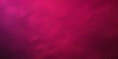 The primary subject of the image is a large, red background. The setting is a cloudy sky, which creates a moody atmosphere. The visual style is a close-up of the red background, emphasizing its vibrant color.