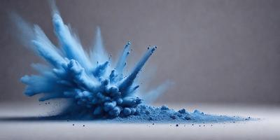 The primary subject of the image is a blue substance, possibly a powder or a liquid, that is being blown or exploded. The setting is a white surface, which provides a clean and uncluttered backdrop for the scene. The visual style of the image is a combination of photo and digital art, as it appears to be a close-up of the blue substance with a slightly blurred background. The dominant colors in the image are blue and white, creating a sense of movement and energy.