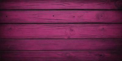 The primary subject of the image is a wooden wall with a pinkish hue. The setting is a room with a wooden floor, and the visual style is a close-up of the wooden wall. The dominant colors are pink and brown, creating a warm and inviting atmosphere.