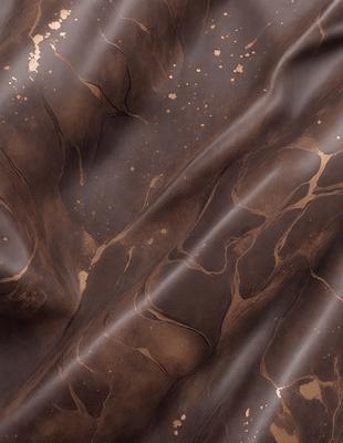 The primary subject of the image is a close-up of a brown, textured surface, possibly a piece of leather or a wall with a unique texture. The setting appears to be a room with a brown wall, and the visual style is a close-up of the textured surface. The colors and mood of the image are predominantly brown, giving it a warm and earthy atmosphere.