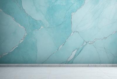 The primary subject of the image is a blue marble wall with a patterned design. The setting is a bathroom, and the visual style is a photo. The dominant colors are blue and white, creating a calm and soothing atmosphere.