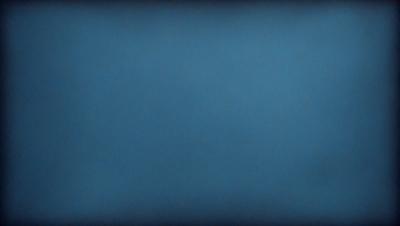 The primary subject of the image is a large, dark blue sky. The setting is a vast, open space with no visible landmarks or objects. The visual style is a simple, unadorned representation of the sky. The colors and mood are predominantly dark and moody, with the blue hue creating a sense of depth and vastness.