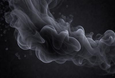The primary subject of the image is a large, swirling cloud of smoke. The setting is a dark background, which contrasts with the smoke, making it the focal point of the image. The visual style is a black and white photo, giving the image a classic and timeless appearance. The colors and mood of the image are predominantly dark and moody, with the smoke creating a dramatic and mysterious atmosphere.