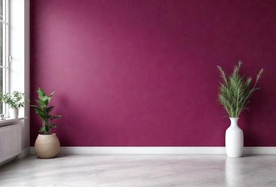 The primary subject of the image is a potted plant placed on a white floor. The plant is situated next to a wall, which is painted in a deep purple color. The setting appears to be a room with a clean and minimalist design. The visual style of the image is a photo, capturing the plant and the wall in a realistic manner. The colors and mood of the image are predominantly purple, creating a calm and serene atmosphere.