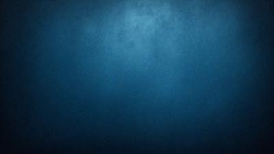 The primary subject of the image is a blue background with a few white specks. The setting is a dark, empty room with a blue wall. The visual style is a close-up of the blue wall, which gives the impression of a textured surface. The colors and mood of the image are predominantly dark and moody, with the blue wall providing a sense of depth and contrast.
