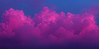 The primary subject of the image is a large, pink cloud with a purple hue. The cloud is floating in a blue sky, creating a striking contrast between the cloud and the sky. The visual style of the image is a combination of photo and digital art, giving it a unique and artistic appearance. The dominant colors in the image are pink and purple, creating a warm and inviting atmosphere.