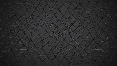 The primary subject of the image is a black background with a pattern of geometric shapes. The setting is a dark room, and the visual style appears to be a combination of a photo and digital art. The dominant colors are black and grey, creating a moody atmosphere.