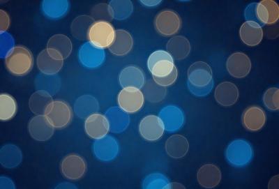 The primary subject of the image is a blue background with a pattern of bright, white, and yellow lights. The lights are scattered throughout the background, creating a visually appealing and dynamic scene. The visual style of the image is a combination of photo and digital art, as it captures the vibrant colors and light patterns in a realistic yet artistic manner. The overall atmosphere of the image is lively and energetic, with the bright lights and blue background creating a sense of movement and excitement.