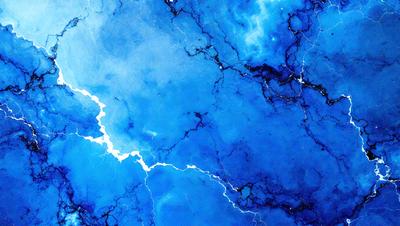 The primary subject of the image is a blue and white marbled surface, which appears to be a piece of art or a decorative item. The setting is a dark blue background, which contrasts with the marbled surface. The visual style is a close-up of the marbled surface, showcasing its intricate patterns and textures. The colors and mood of the image are predominantly dark and moody, with the blue marbled surface serving as a striking focal point.