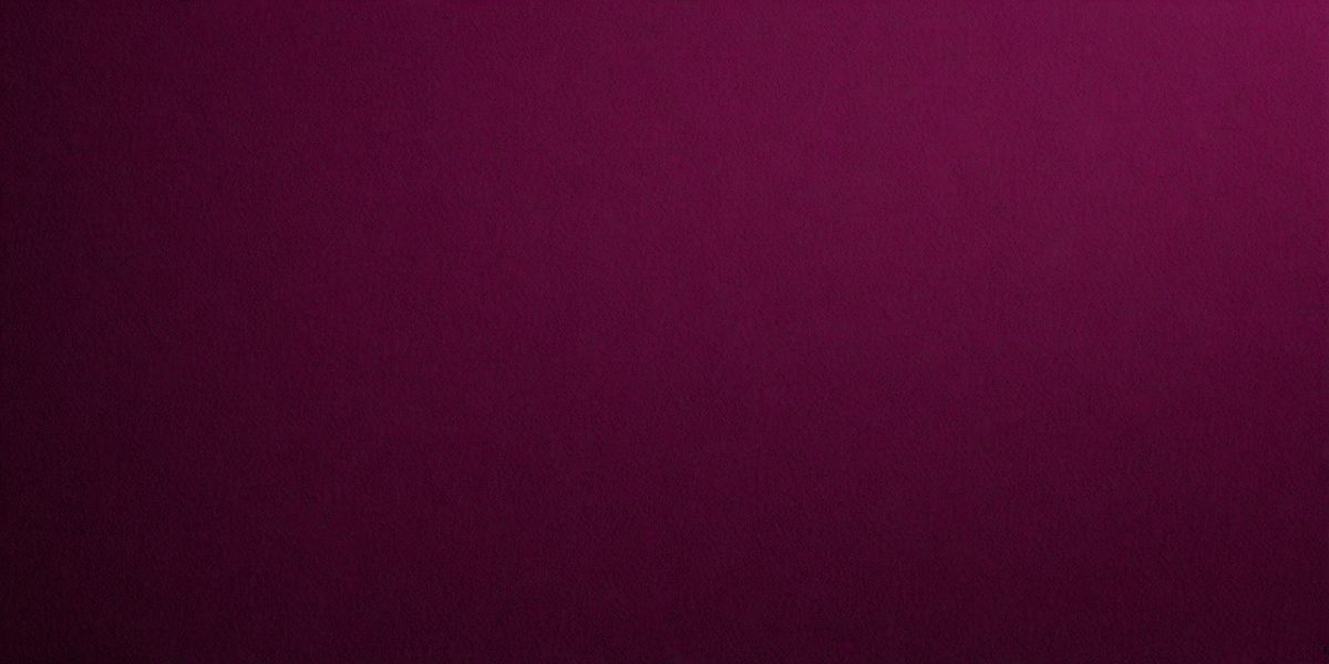 The primary subject of the image is a purple background. The setting is a dark room, and the visual style is a close-up of the purple background. The colors and mood of the image are predominantly purple, creating a calm and serene atmosphere.