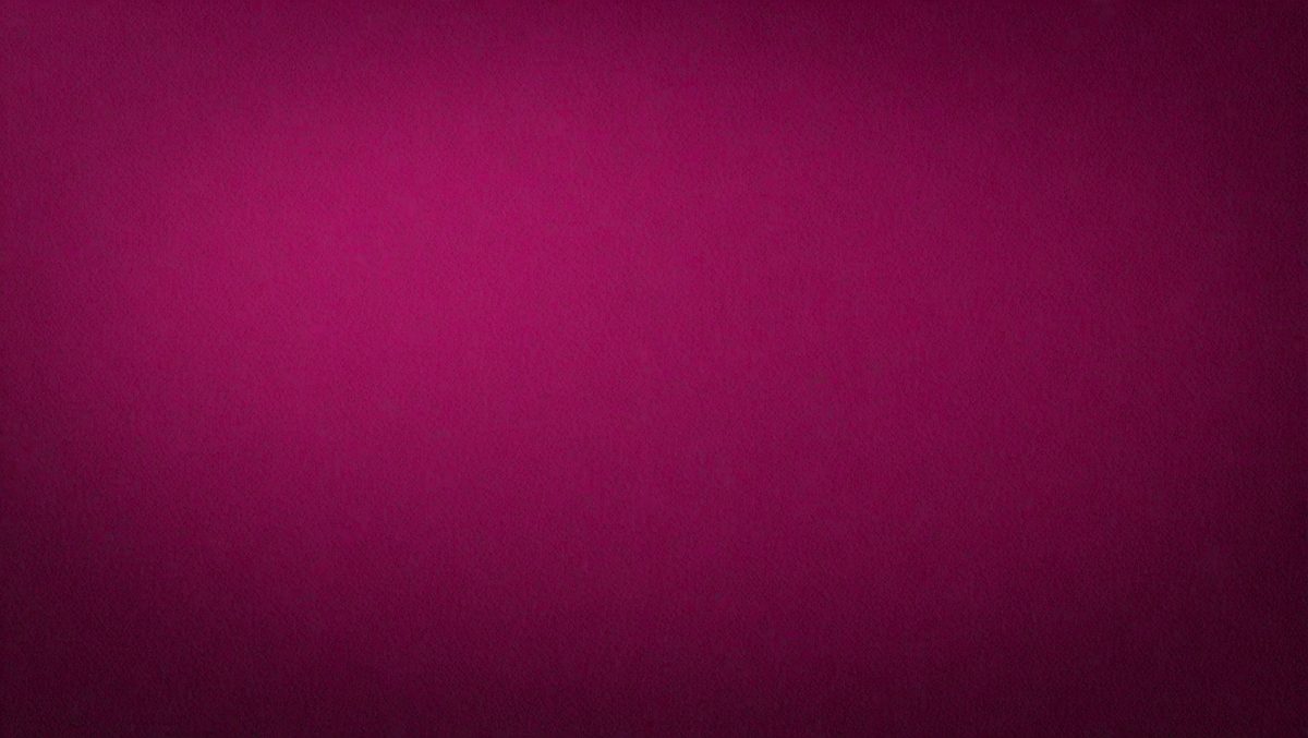 The primary subject of the image is a large, pink wall. The setting is a room with a pink background, and the visual style is a close-up of the wall. The dominant colors in the image are pink, and the overall atmosphere is warm and inviting.