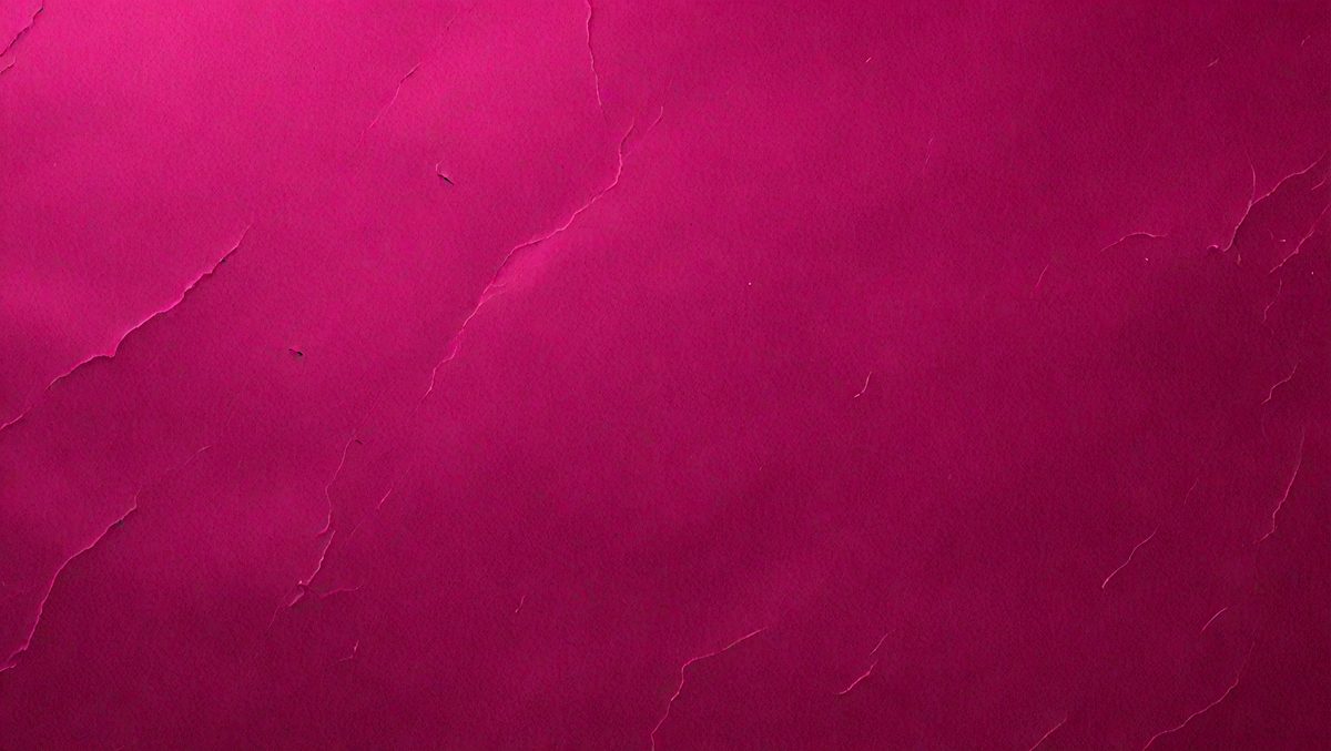 The primary subject of the image is a close-up of a pink leather surface. The setting is a room with a pink background. The visual style is a photo, and the colors and mood are predominantly pink, creating a warm and inviting atmosphere.
