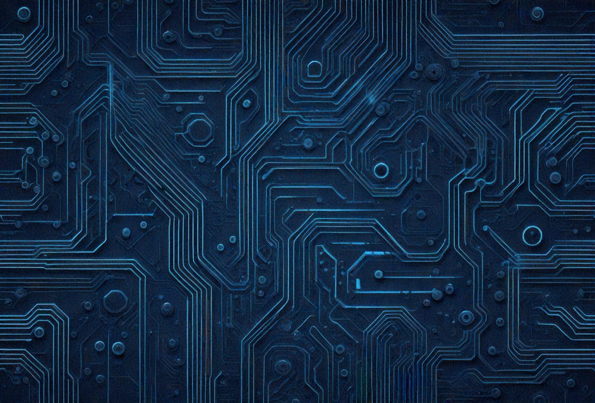 The primary subject of the image is a close-up of a computer circuit board. The setting is a dark blue background, which contrasts with the circuit board's intricate design. The visual style is a detailed, close-up photo of the circuit board. The colors and mood of the image are predominantly dark and moody, with the blue background providing a sense of depth and contrast.