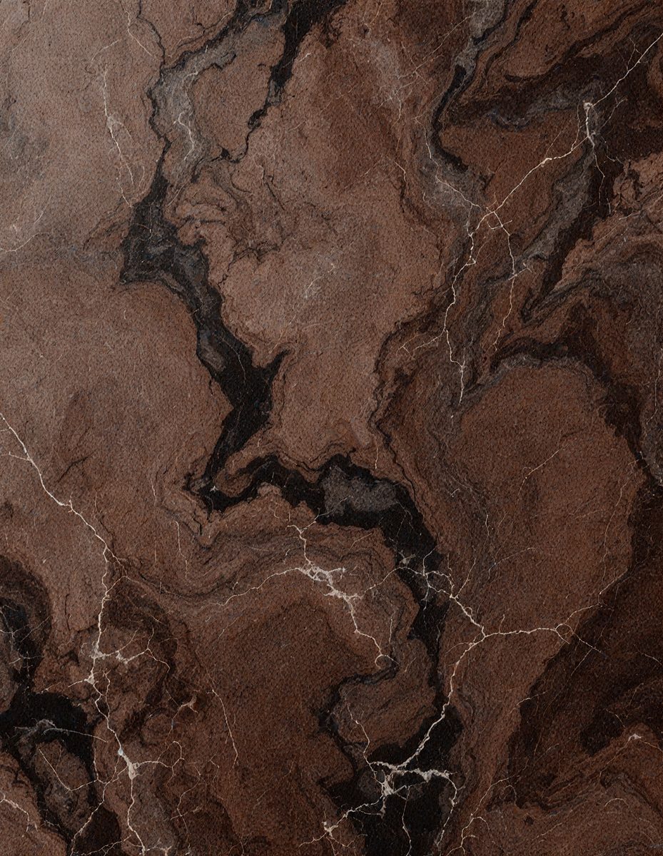 The image features a marble surface with a brown and black color scheme. The marble has a unique pattern, giving it a distinctive appearance. The setting appears to be a room with a stone wall, which adds to the overall ambiance of the space. The visual style of the image is a close-up of the marble surface, showcasing its intricate patterns and textures. The colors and mood of the image are warm and earthy, creating a sense of natural beauty and elegance.