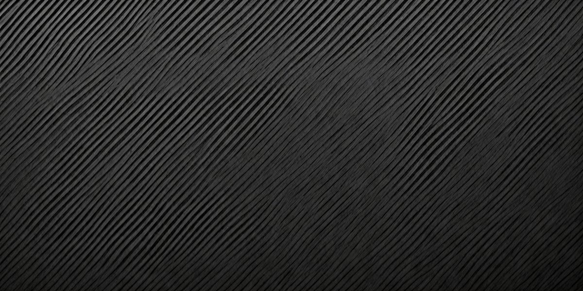 The primary subject of the image is a black and white patterned surface. The setting is a black background, and the visual style is a patterned texture. The dominant colors are black and white, creating a mood of simplicity and elegance.