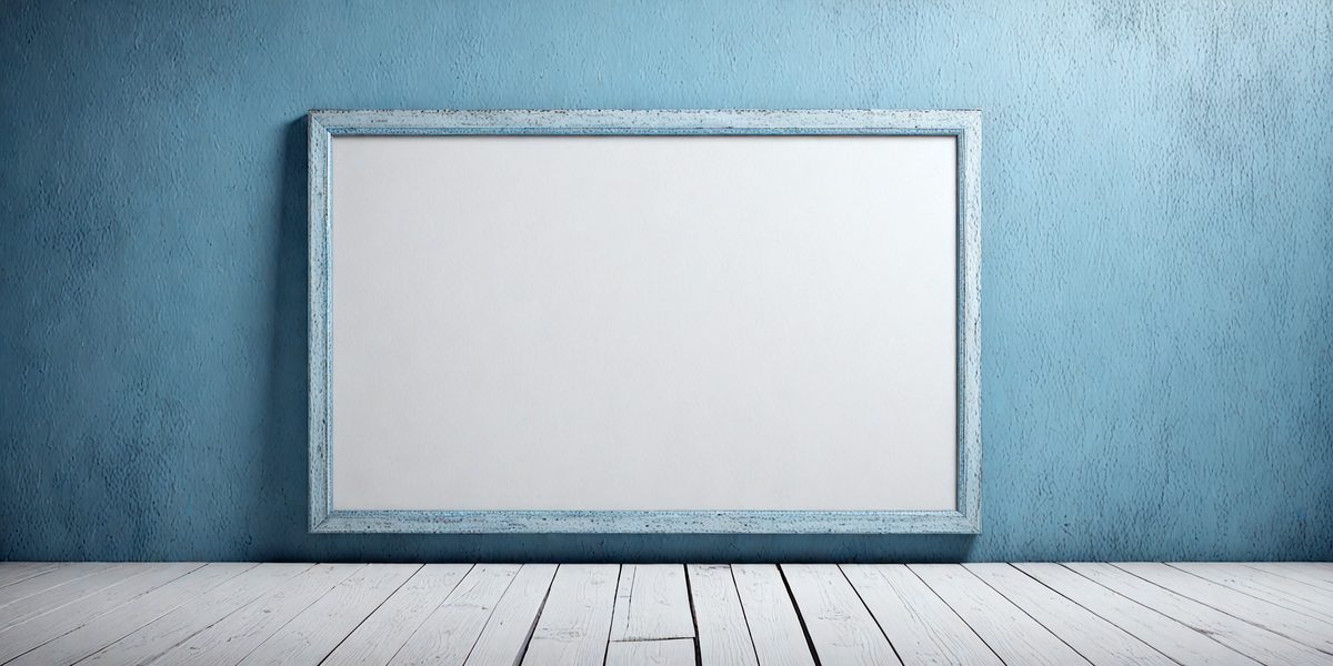 The primary subject of the image is a large white board or canvas, which is placed on a wooden table. The setting is a room with a blue wall, creating a contrasting backdrop. The visual style of the image is a photo, capturing the details of the white board and the wooden table. The colors and mood of the image are predominantly white and blue, giving it a clean and calm atmosphere.