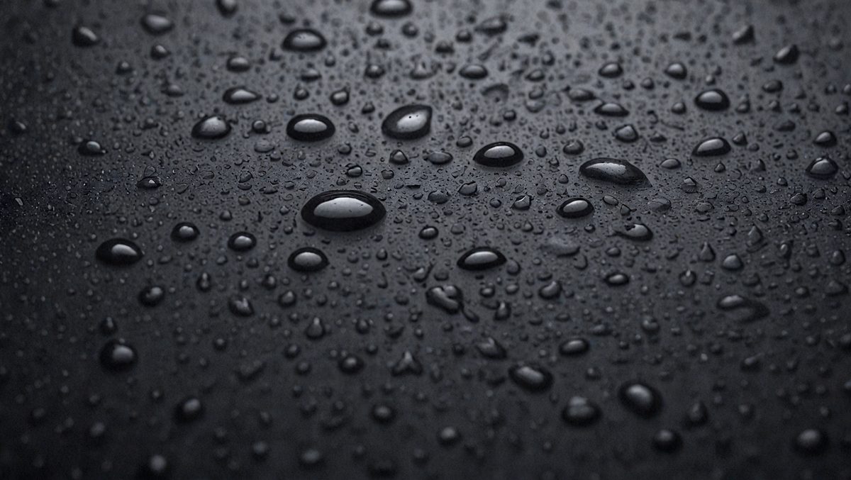 075c5ff5-05f1-4de9-871d-8a0827c87b46-freepik__closeup-of-black-raindrops-on-dark-surface-abstrac__98521_250525072615_00001.png
