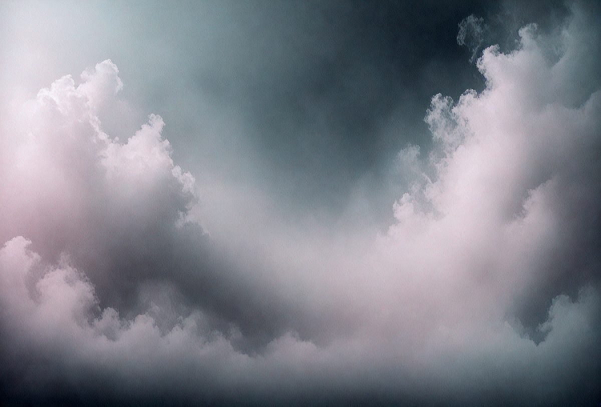 The primary subject of the image is a cloudy sky. The setting is a dark, cloudy day with a stormy atmosphere. The visual style is a photo of the cloudy sky. The colors and mood are dark and moody, with the clouds creating a dramatic backdrop.