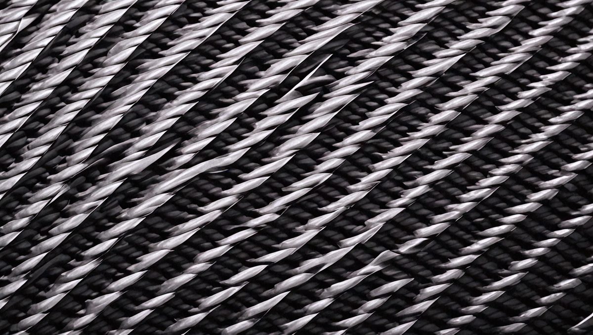 0f7cd283-ca60-46c4-ad09-d059d8b24b65-freepik__carbon-fiber-texture-new-technology-background__36108_250525071958_00001.png