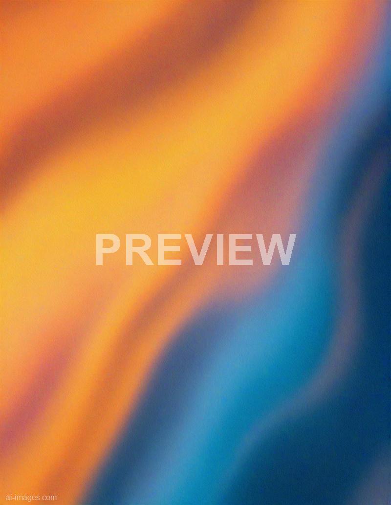 The image appears to be an abstract blur of colors, primarily featuring warm shades of orange and yellow blending into cooler tones of blue and dark blue. The colors are smoothly transitioned, creating a soft, out-of-focus effect with no distinct shapes or objects visible. It gives an impression of motion or a close-up of a colorful surface out of focus.