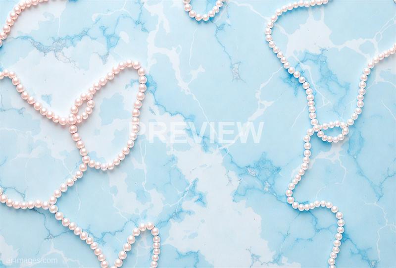 freepik__pearls-on-pastel-alice-blue-marble-color-backgroun__49045_00000