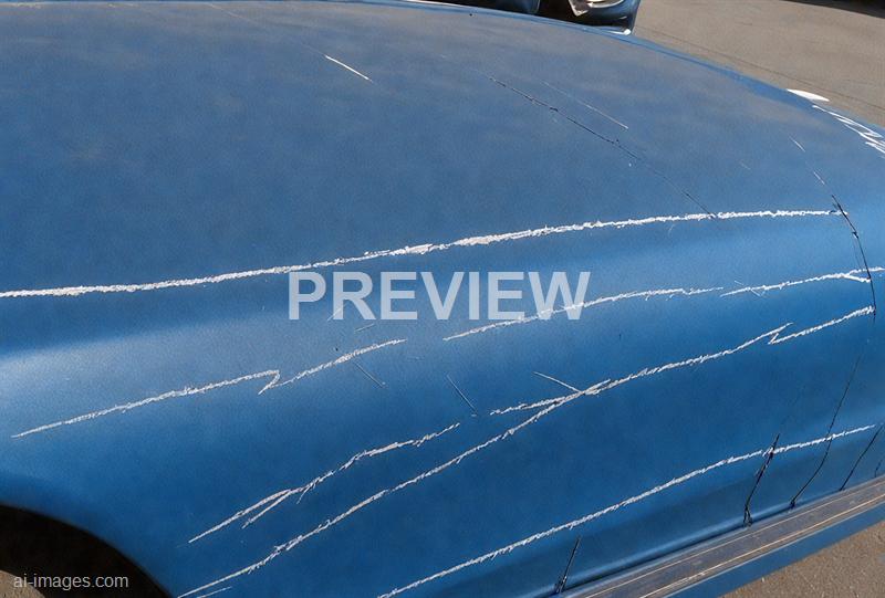 freepik__long-scratch-on-blue-car-paint__57403_250525094945_00001