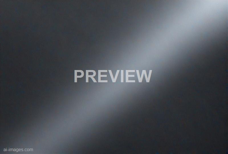 The image appears to be heavily blurred with no discernible objects or details visible, making it difficult to describe specific elements or scene content. The overall tone of the image is dark with some lighter areas, but no clear shapes or subjects can be identified.