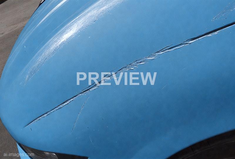 freepik__long-scratch-on-blue-car-paint__57402_250525094941_00001