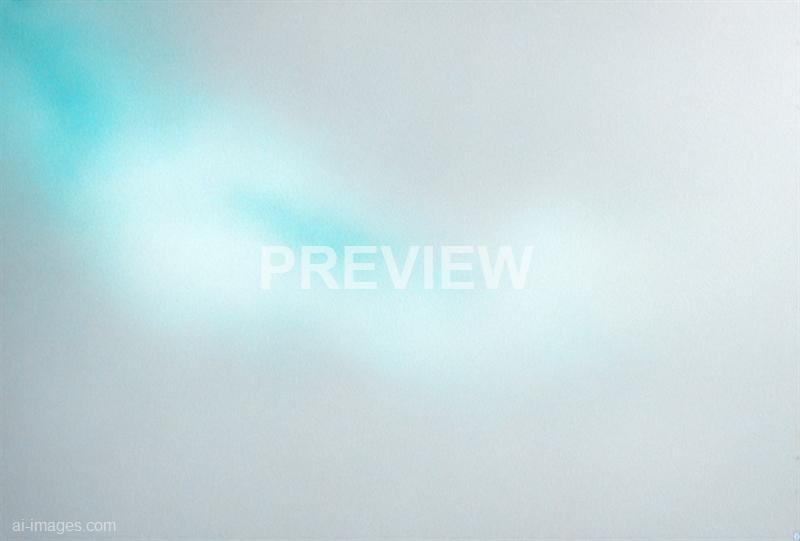 The image appears to be highly blurred or out of focus, showing a soft gradient of colors that range from light blue to white, with no distinct objects or features visible. The lack of sharp details makes it difficult to identify any specific elements or context within the image.