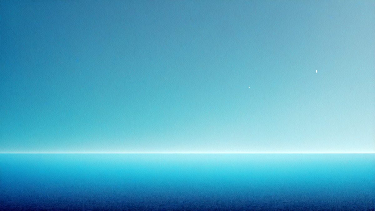 The primary subject of the image is the vast, open ocean. The setting is a clear blue sky, with no clouds or other obstructions visible. The visual style is a photo, capturing the beauty of the ocean and the sky. The colors and mood are predominantly blue, creating a serene and peaceful atmosphere.